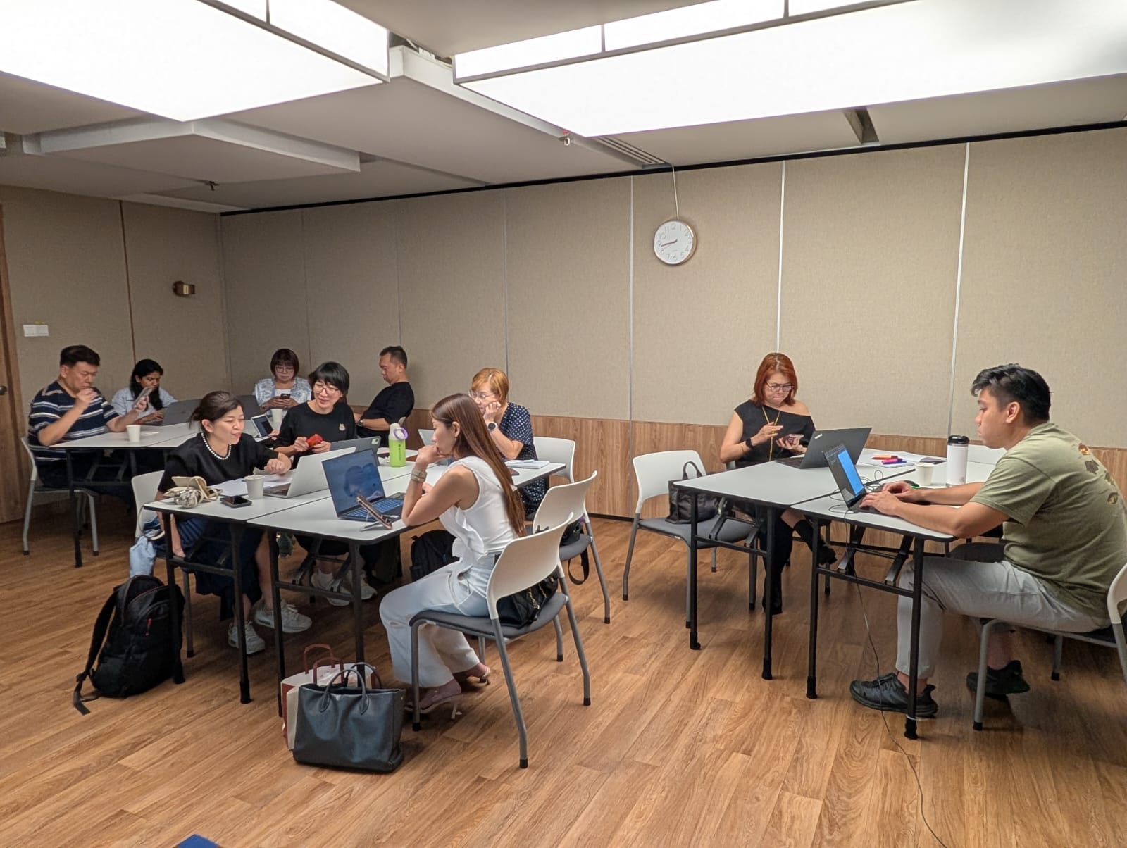 Participants working together on laptops during a Kodee workshop session.